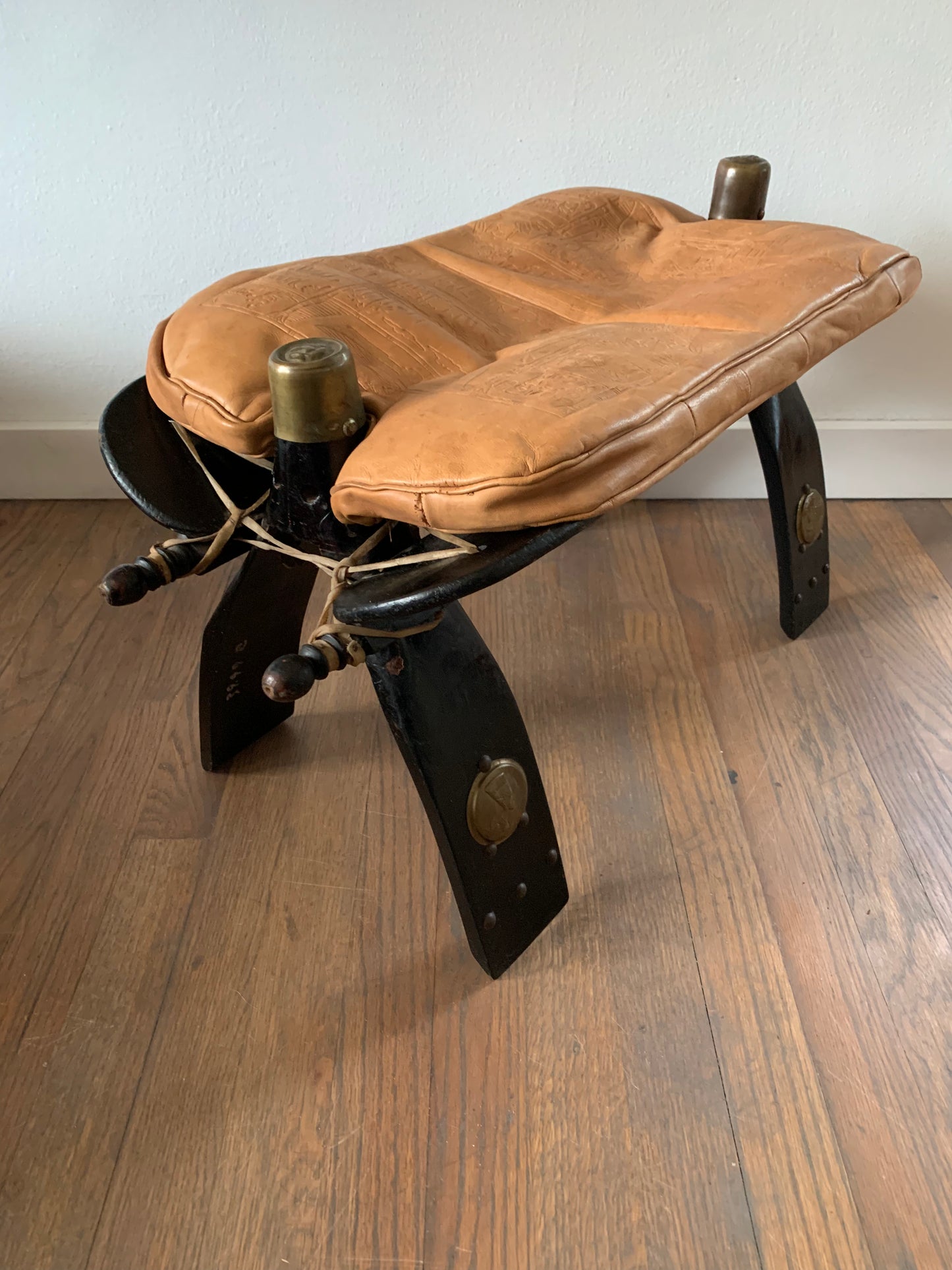 Vintage Leather Camel Saddle Ottoman Stool With Egyptian Motif