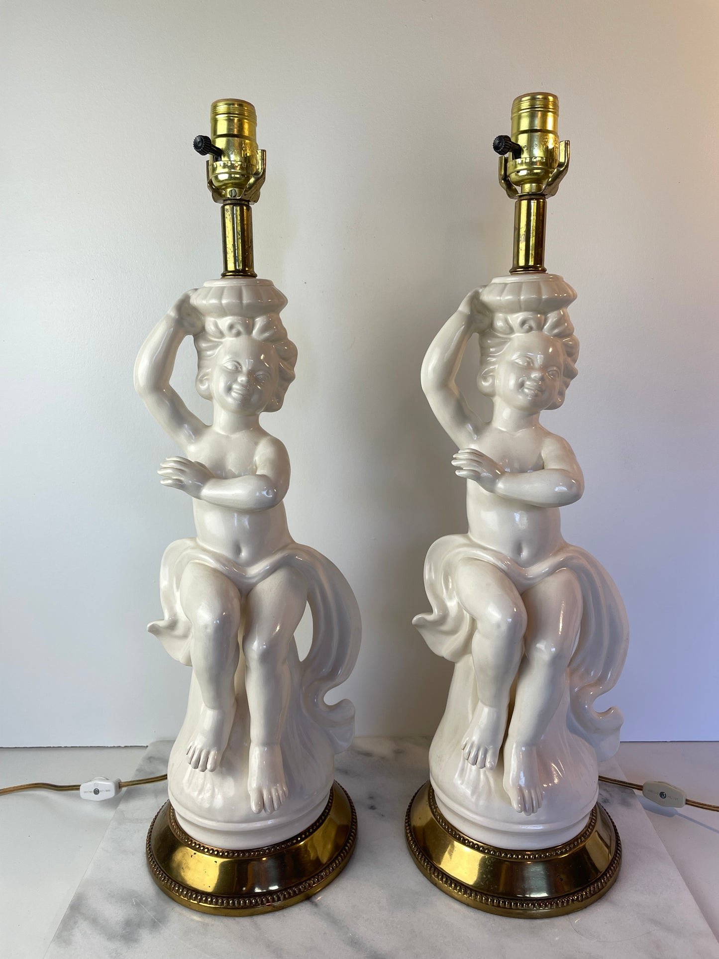 Mid 20th Century Hollywood Regency White Porcelain Cherub Lamps - A Pair