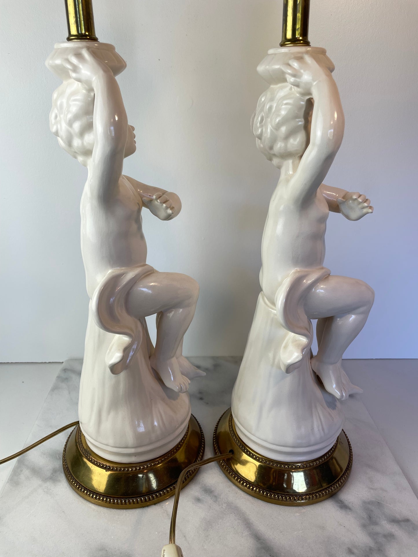 Mid 20th Century Hollywood Regency White Porcelain Cherub Lamps - A Pair