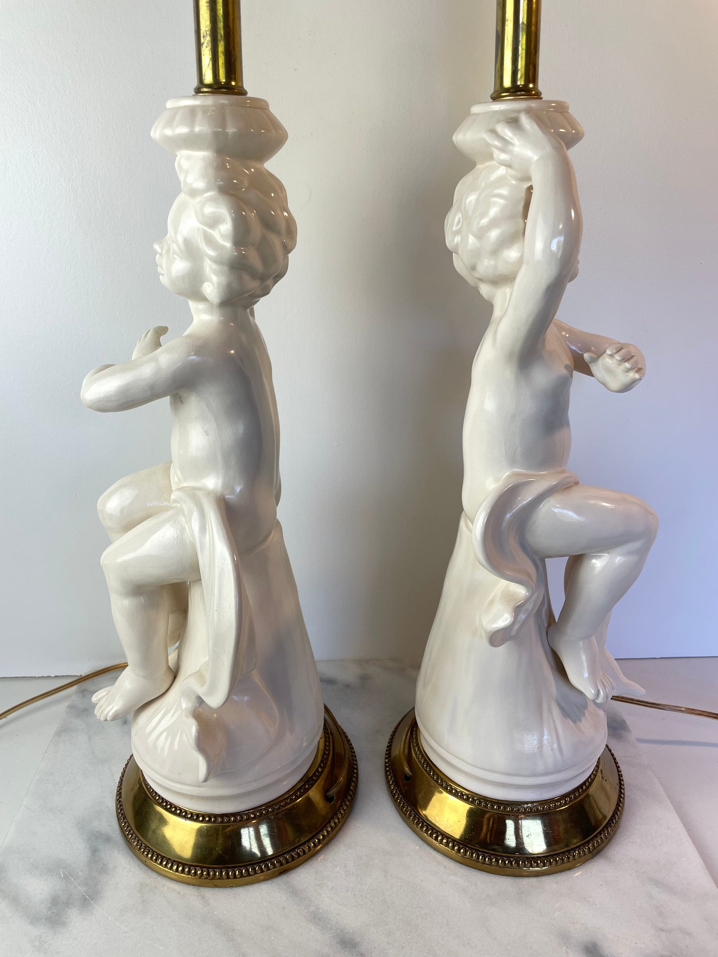 Mid 20th Century Hollywood Regency White Porcelain Cherub Lamps - A Pair