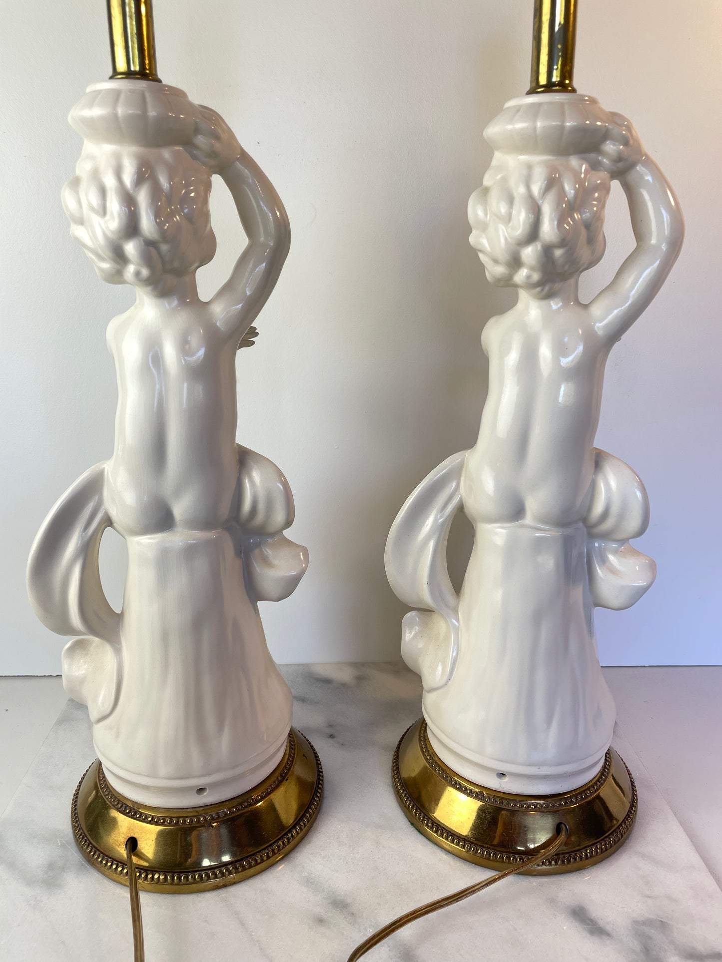 Mid 20th Century Hollywood Regency White Porcelain Cherub Lamps - A Pair